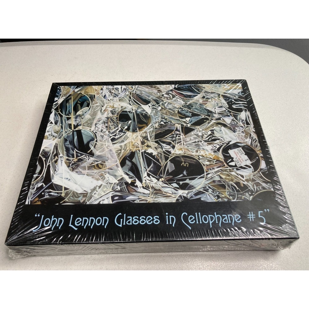 John Lennon Glasses in Cellophane #5 Jigsaw Puzzle by Artist Rob Gratiot